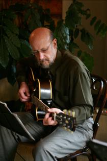 Close-up of Michael DeLuzio playing guitar at a gig
