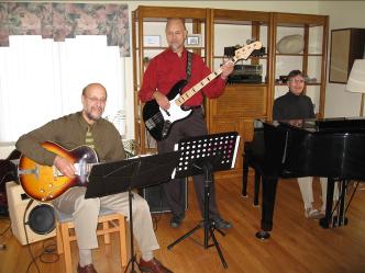 photo of Peter Torpey, Mike DeLuzio and Cy Edmunds practicing in Pete's living room